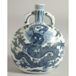 A CHINESE BLUE AND WHITE PORCELAIN TWIN HANDLE MOON FLASK, decorated with large dragon and bearing