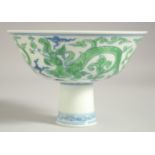 A CHINESE MING STYLE PORCELAIN PEDESTAL BOWL, painted with 'kui dragons', with six-character mark to