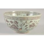 A CHINESE MING STYLE UNDER GLAZE RED PORCELAIN BOWL, 19cm diameter.