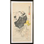 A CHINESE PAINTING OF A CALLIGRAPHER, inscribed and with red seal mark, framed and glazed, 65cm x