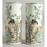 A PAIR OF CHINESE REPUBLIC POLYCHROME CYLINDRICAL VASES, decorated with a bird and flora, with