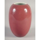 A CHINESE COPPER RED PORCELAIN POT, six-character mark to base, 15cm high.