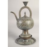 AN ISLAMIC SILVER OVERLAID BRASS EWER, on stand, with panels of calligraphy, 31cm high overall.