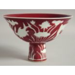 A CHINESE COPPER RED AND WHITE PORCELAIN PEDESTAL BOWL, with fish and aquatic flora, bowl 17cm