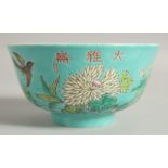 A 19TH CENTURY CHINESE TURQUOISE GROUND FAMILLE ROSE BOWL, decorated with flora and bird, four-