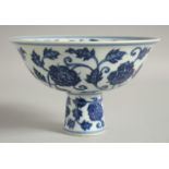 A CHINESE BLUE AND WHITE PORCELAIN PEDESTAL BOWL, with floral decoration, bowl 17cm diameter.
