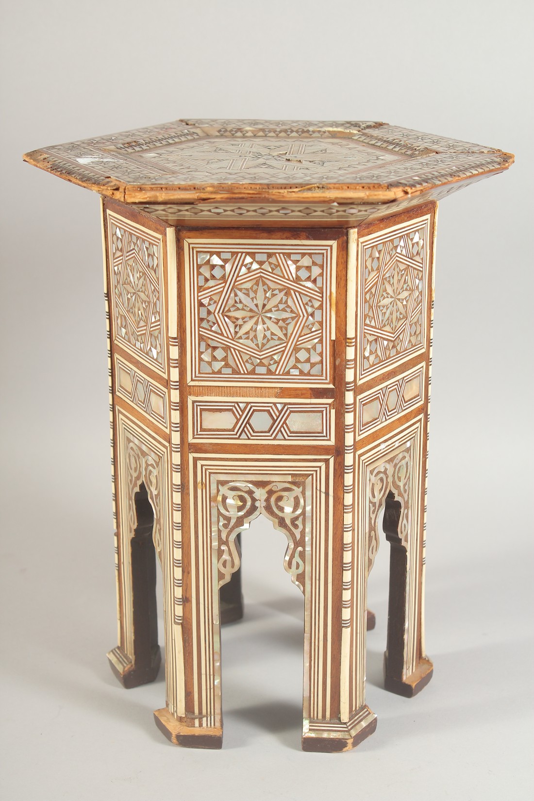 AN OTTOMAN MOTHER OF PEARL INLAID WOODEN STAND, (with faults), 31cm high.