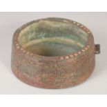 A 10TH-11TH CENTURY PERSIAN GHAZNAVID BRONZE BOWL, with Kufic calligraphy, 13cm diameter.