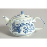 A CHINESE BLUE AND WHITE PORCELAIN TEAPOT, with 'kui dragon' decoration, 15.5cm spout to handle.