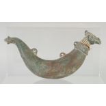 AN 18TH CENTURY MUGHAL INDIAN BRONZE POWDER FLASK, the lid in the form of a bird head, 20cm long.