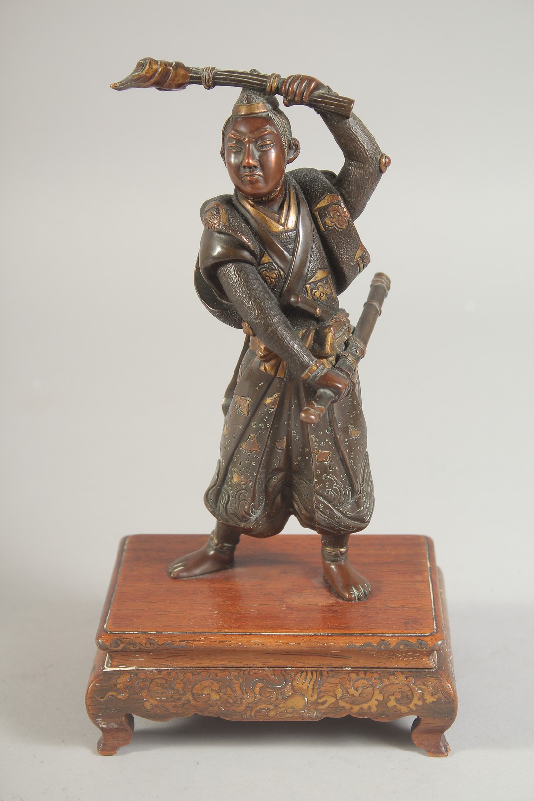 A FINE JAPANESE BRONZE OKIMONO of a warrior, signed Miyao Zo, mounted to a wooden base, 19.5cm