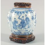 A CHINESE BLUE AND WHITE PORCELAIN JAR, with a carved and pierced cover and stand, the jar painted