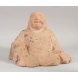 A TERRACOTTA SEATED BUDDHA, 25cm wide.