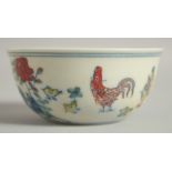 A CHINESE DOUCAI PORCELAIN CHICKEN CUP, 8.5cm diameter.
