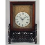 A 19TH CENTURY CHINESE ROSEWOOD CASED MANTLE CLOCK, with fusee movement, circular enamel dial with