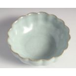 A SMALL CHINESE RIBBED CELADON CRACKLE GLAZE BOWL, 11.5cm diameter.