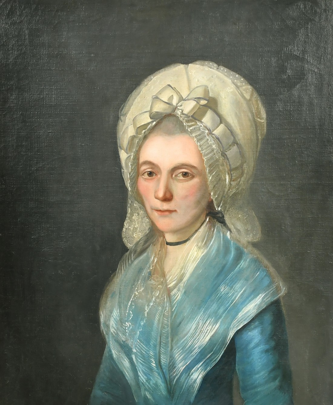 Mid-19th Century Continental School, a half length portrait of a lady in a white bonnet, oil on