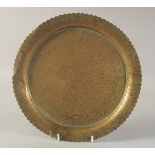 AN ENGRAVED FLORAL BRASS DISH, 30cm diameter.