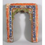 A 19TH CENTURY ISLAMIC INDIAN MIHRAB SHAPED POTTERY TILE, with polychrome decoration, 43.5cm high