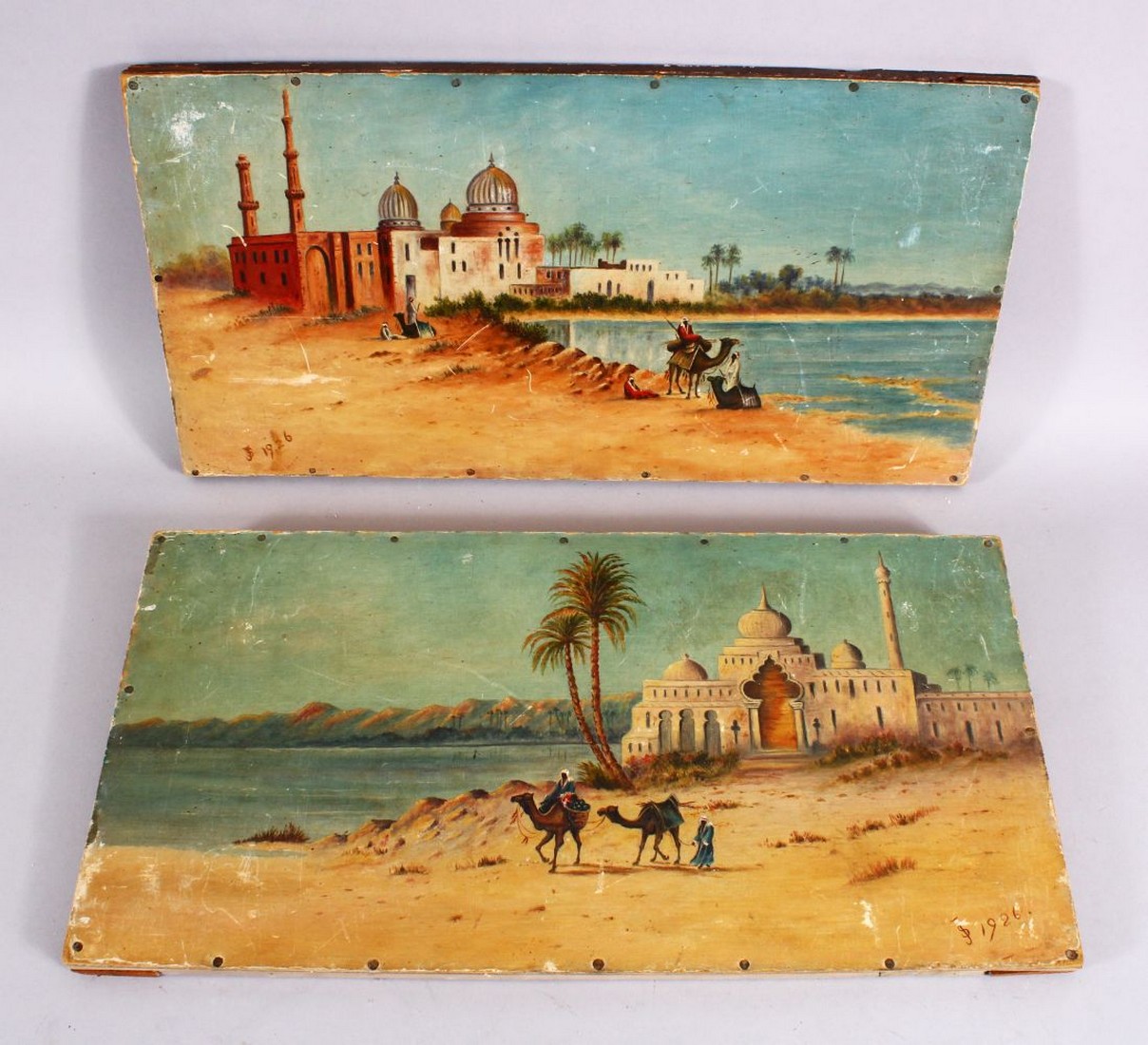 A PAIR OF 20TH CENTURY ISLAMIC ORIENTALIST PAINTING ON WOOD, each depicting a native waterside