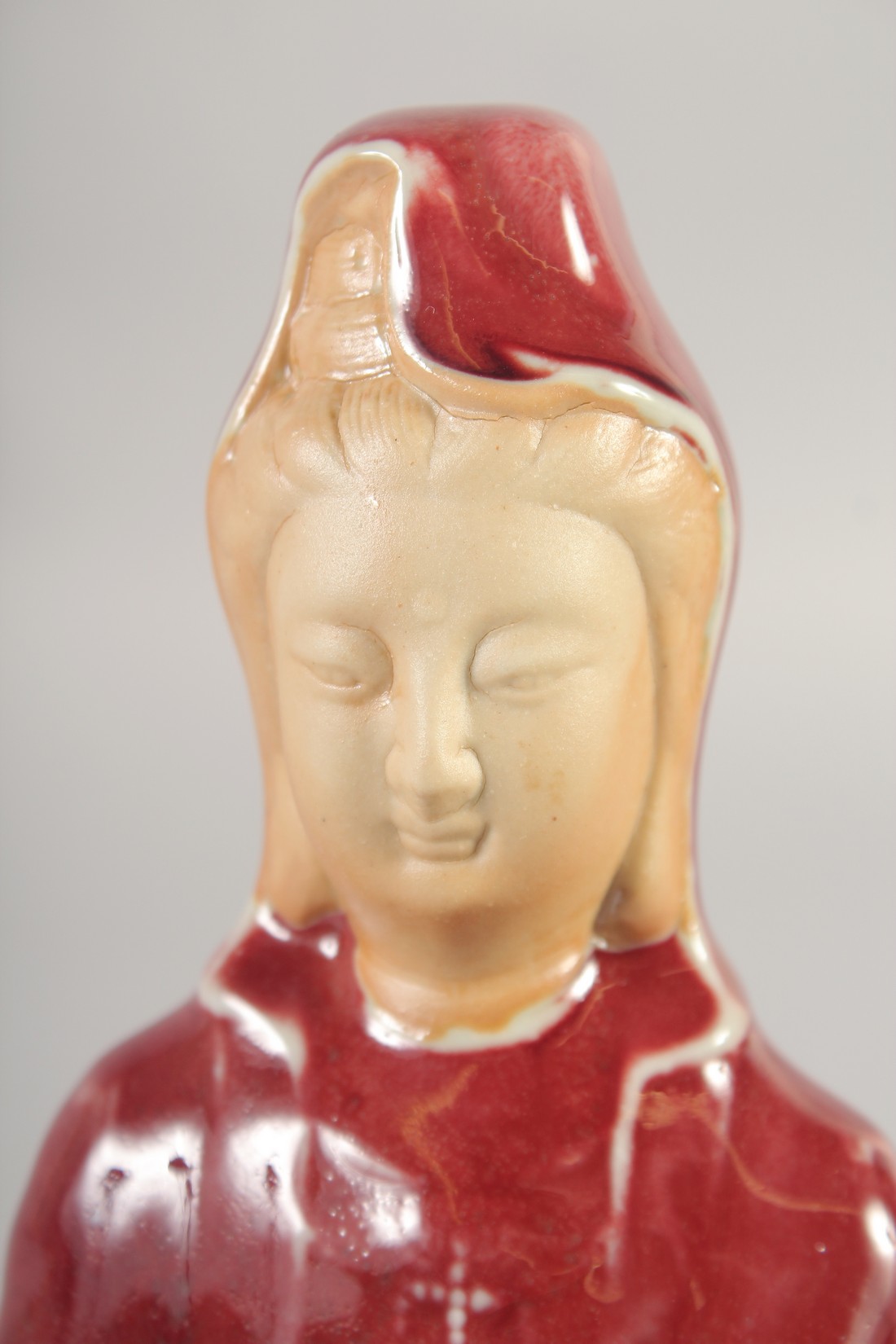 A CHINESE COPPER RED GLAZE PORCELAIN FIGURE, 21cm high. - Image 5 of 6