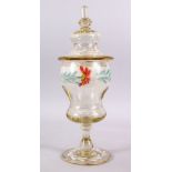 A 19TH CENTURY ENAMELLED GLASS VASE & COVER, with enamel floral decoration and gilt highlights, 41cm