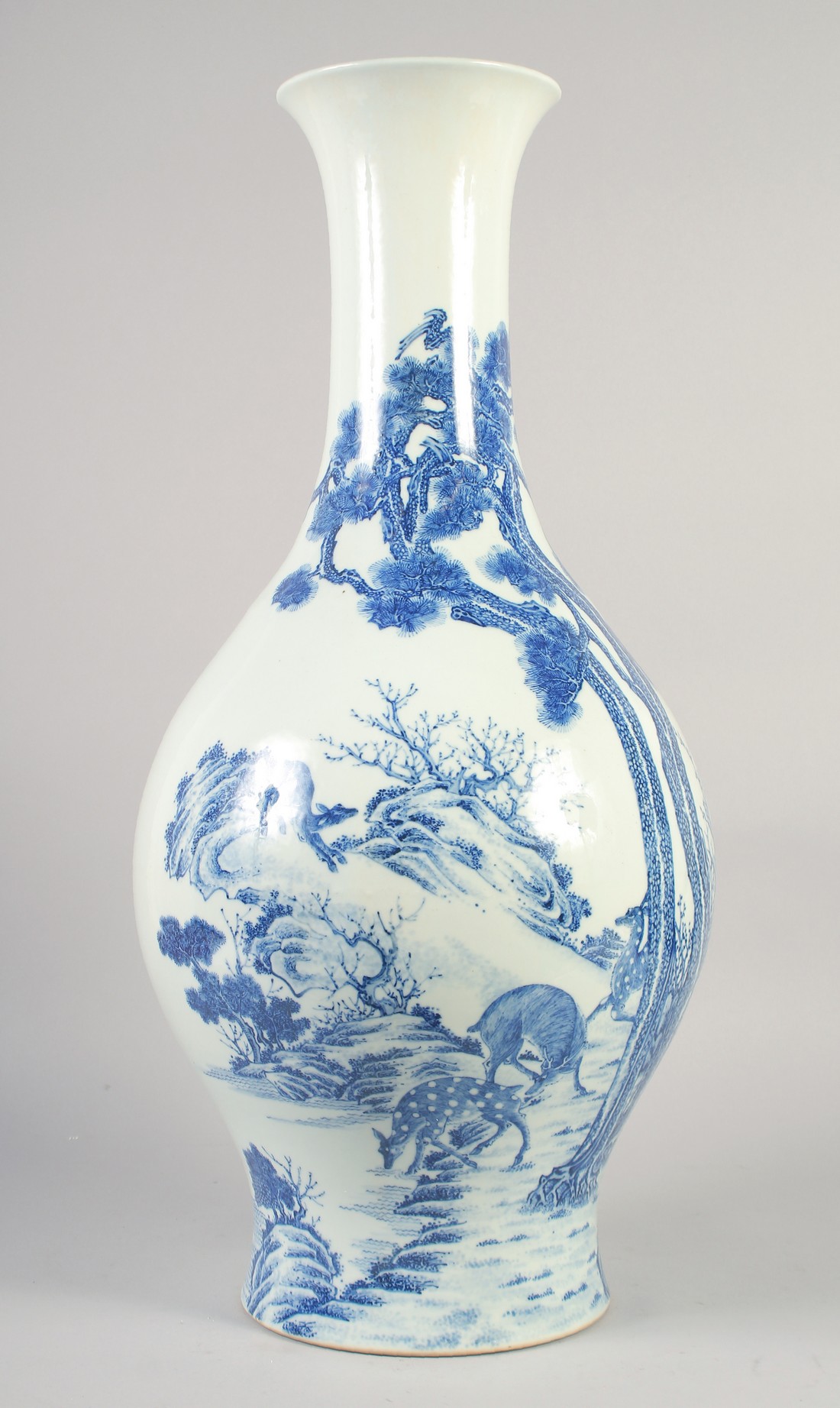 A LARGE EARLY 20TH CENTURY CHINESE BLUE AND WHITE VASE, painted with deer beside a pine tree, six-