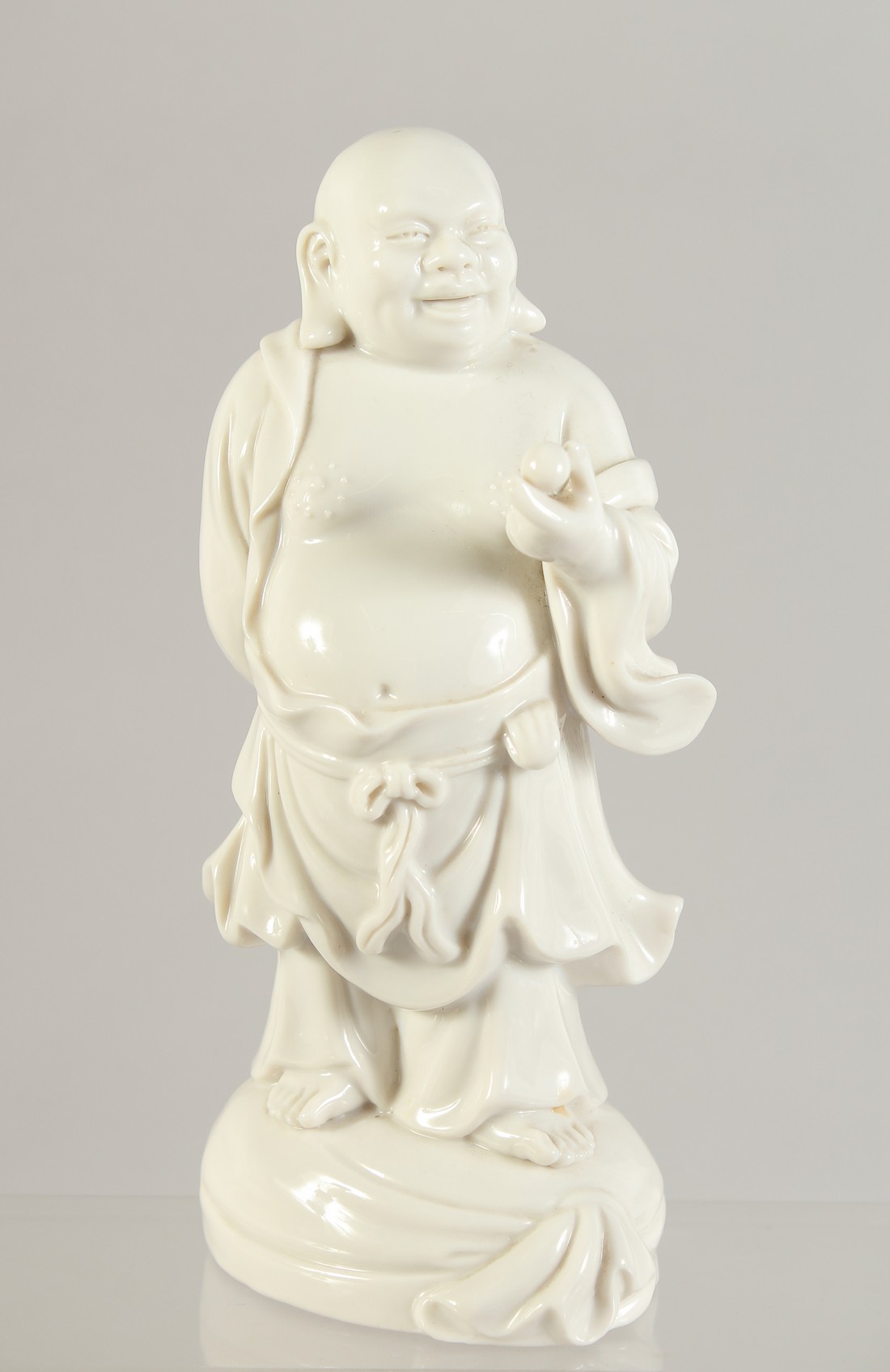 A BLANC DE CHINE PORCELAIN FIGURE OF AN IMMORTAL, 19.5cm high.