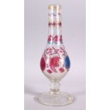 A 19TH CENTURY ISLAMIC TURKISH CUT GLASS HUQQA BASE, with floral decoration, 30cm high.