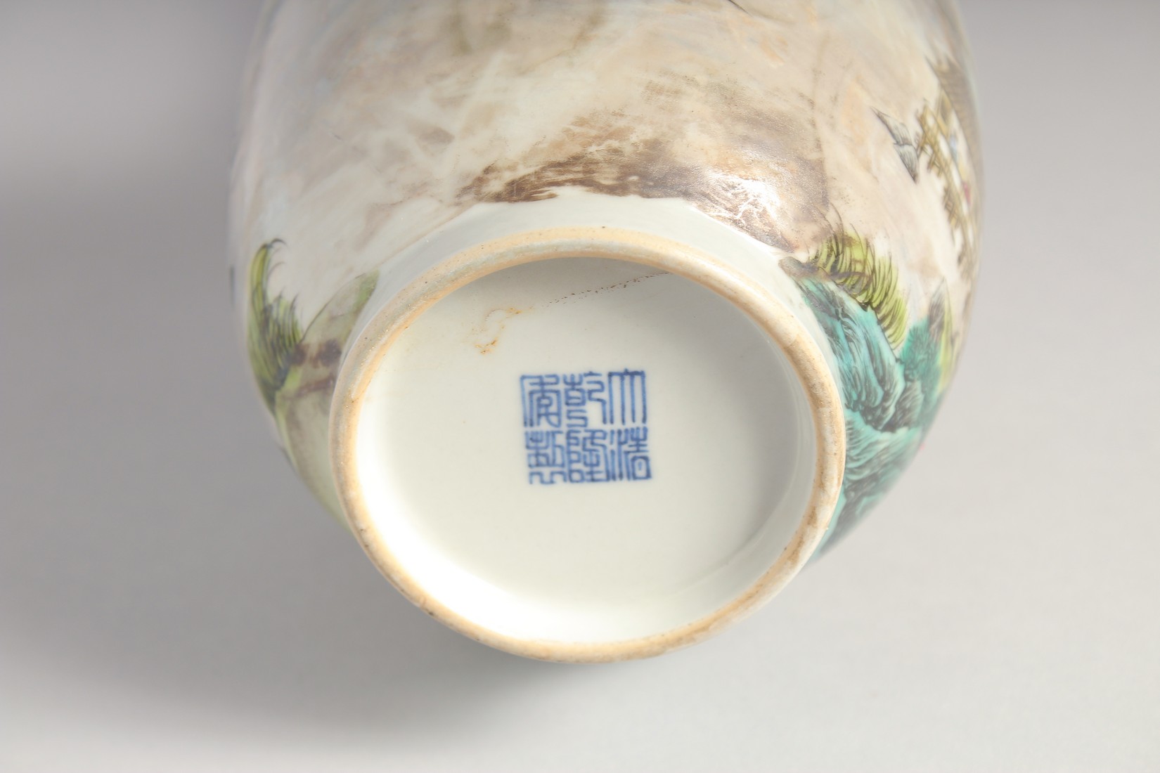 A CHINESE FAMILLE ROSE TWIN HANDLE VASE, painted with a mountainous landscape, the base with six- - Image 6 of 7