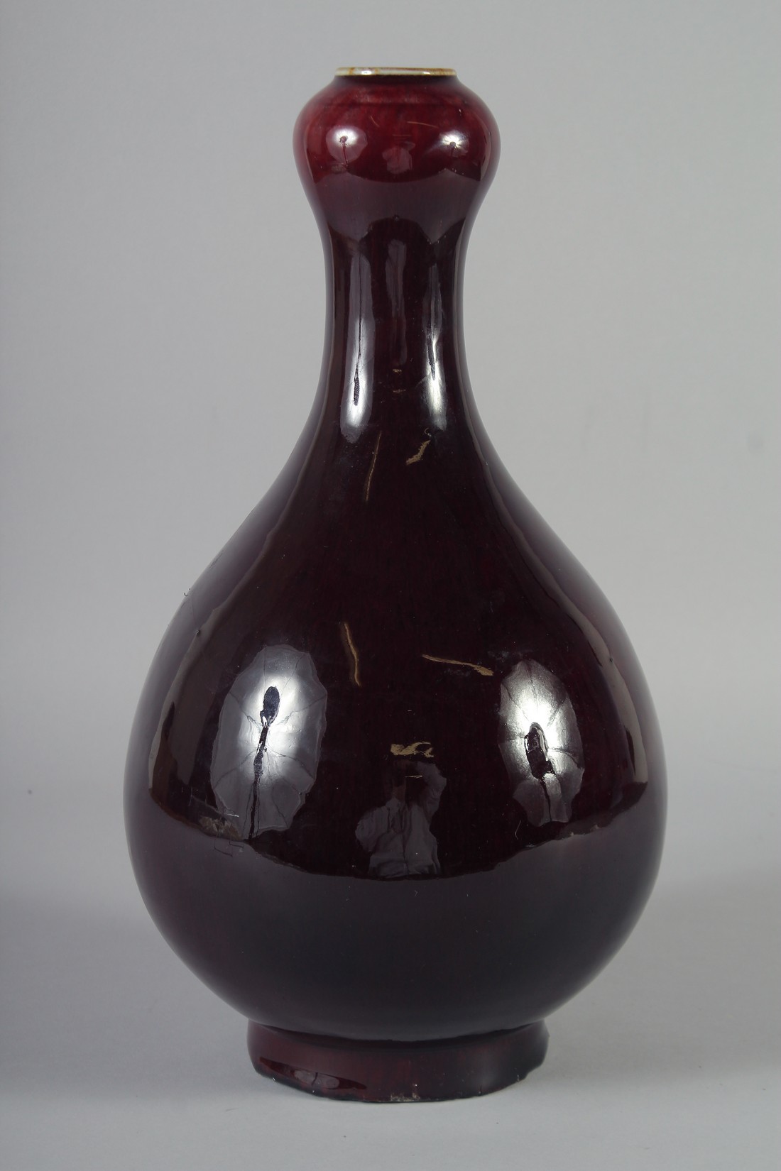 A CHINESE FLAMBE GLAZED PORCELAIN BOTTLE VASE, with a garlic neck, the sides applied with a dark - Image 3 of 5