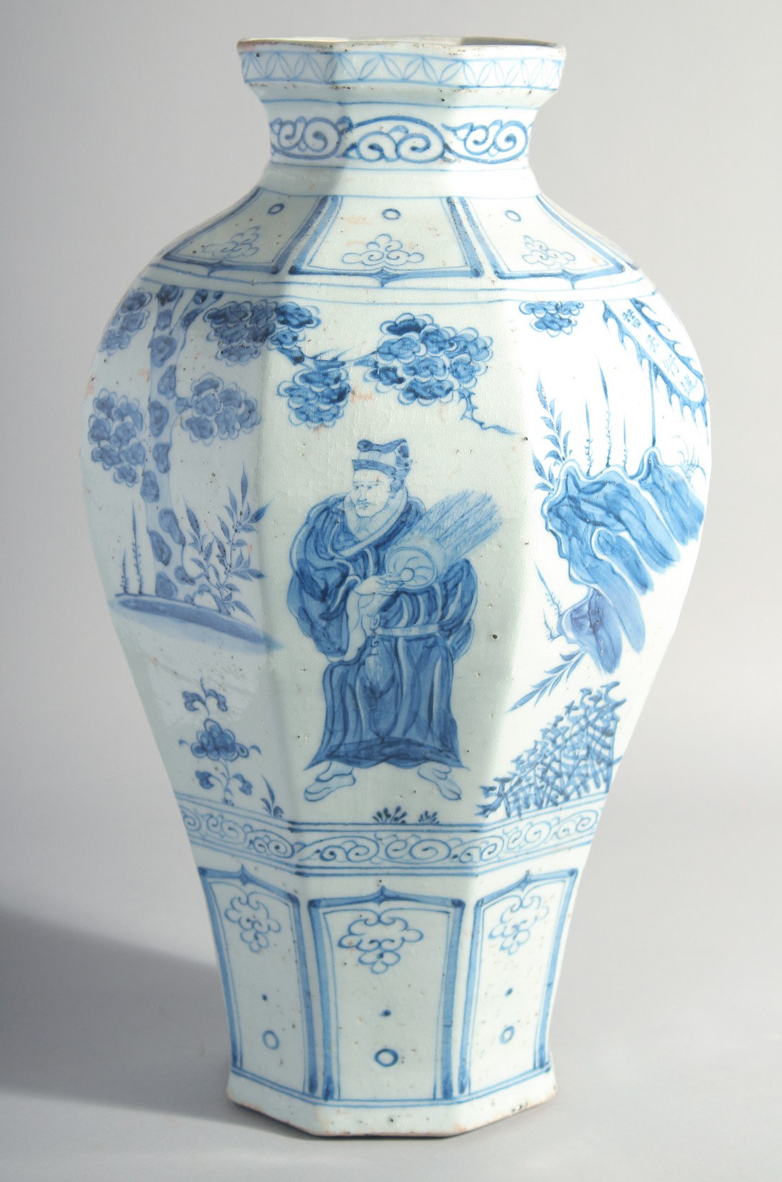 A LARGE CHINESE BLUE AND WHITE GLAZED POTTERY VASE, painted with figures and flora, 42cm high.