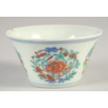 A CHINESE DOUCAI PORCELAIN CUP, six-character mark to base, 7.5cm diameter.