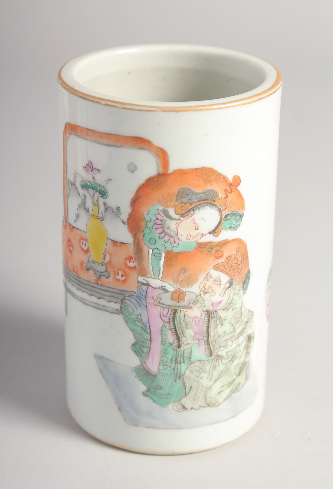 A CHINESE FAMILLE ROSE PORCELAIN BRUSH POT, painted with a male and female figure, character mark to