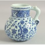 A CHINESE BLUE AND WHITE PORCELAIN JUG, with zoomorphic handle, 14cm high.