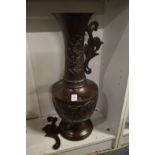 A large Japanese bronze vase (handle and upper section detached).
