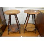A pair of small walnut two tier occasional tables.