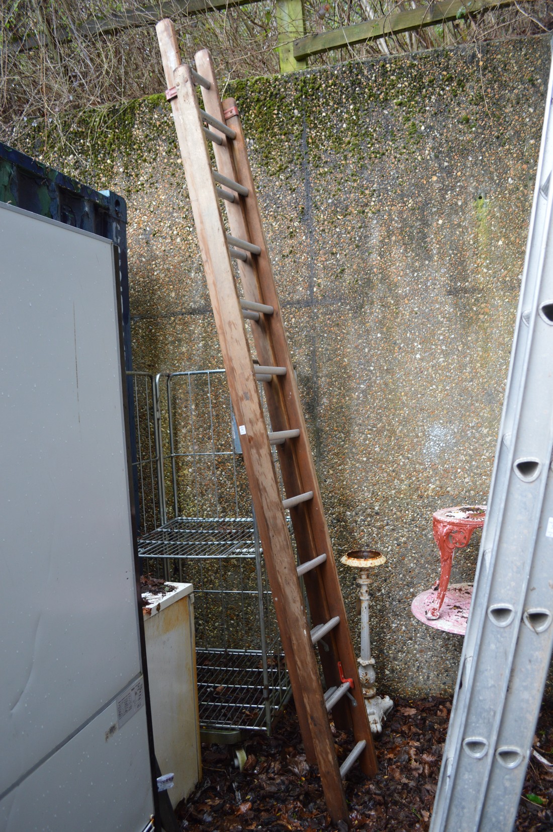 A wooden two section ladder.