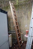 A wooden two section ladder.