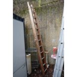 A wooden two section ladder.