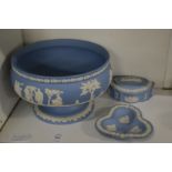 A Wedgwood blue jasperware pedestal bowl, trinket box and cover and small dish.