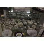 A large collection of Wedgwood green jasperware trinket boxes, dishes, vases etc.