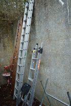 An aluminium two section ladder and two step ladders.