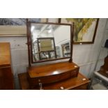 A good George III mahogany bow fronted dressing table mirror.