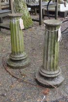 A pair of composite fluted columns.