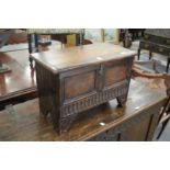 An 18th century and later miniature oak coffer.