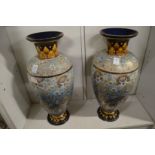 A large pair of Doulton Slaters Patent vases decorated with stylised leaves and flowers (chips to