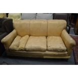 A late Victorian three seater settee in the Howard style.