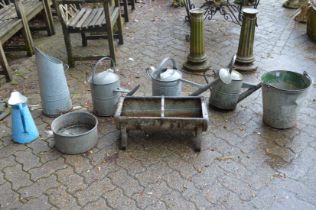 A galvanized watering cans, buckets etc.