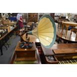 A Selecta oak cased wind-up gramophone with large painted horn and various records.